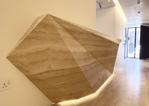 Concierge desk with natural stone in artful form